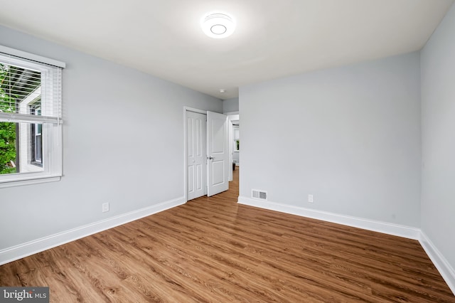 904 Stevenson Ln, Towson, MD 21286 - unfurnished bedroom featuring wood finished floors and a closet