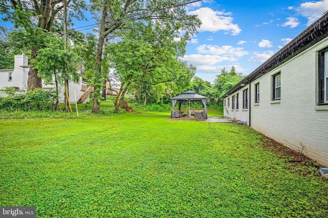 904 Stevenson Ln, Towson, MD 21286 - view of green lawn featuring a gazebo and a patio area