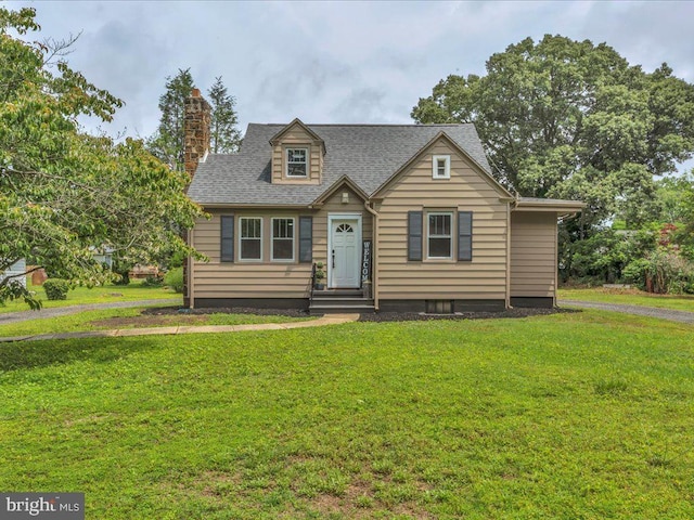 69 Mary Elmer Dr, Bridgeton, NJ 08302 - view of front of home featuring a front lawn, a chimney, and roof with shingles