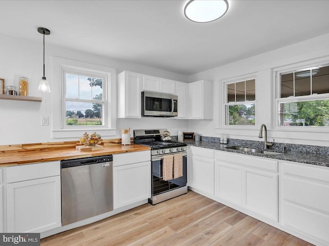 69 Mary Elmer Dr, Bridgeton, NJ 08302 - kitchen with appliances with stainless steel finishes, white cabinetry, wood counters, and decorative light fixtures