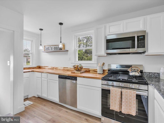 69 Mary Elmer Dr, Bridgeton, NJ 08302 - kitchen with stainless steel appliances, wood counters, white cabinets, light wood-style floors, and decorative light fixtures