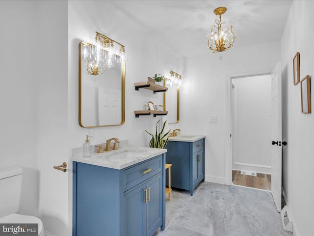 69 Mary Elmer Dr, Bridgeton, NJ 08302 - bathroom featuring a chandelier and two vanities
