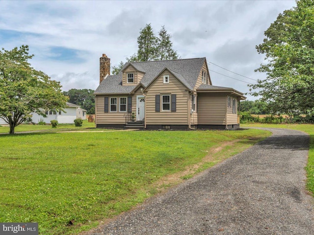 69 Mary Elmer Dr, Bridgeton, NJ 08302 - new england style home featuring a chimney, a front yard, and roof with shingles