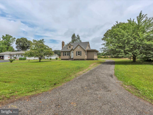69 Mary Elmer Dr, Bridgeton, NJ 08302 - view of front of home with driveway, a front yard, and a chimney