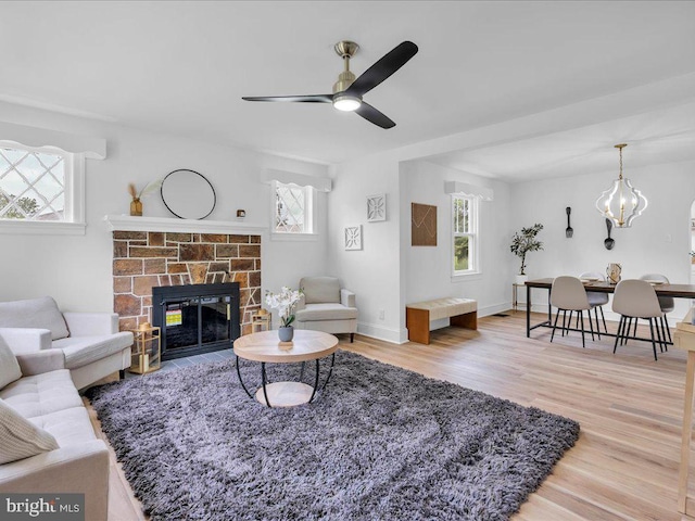 69 Mary Elmer Dr, Bridgeton, NJ 08302 - living area with plenty of natural light, a ceiling fan, wood finished floors, and a glass covered fireplace