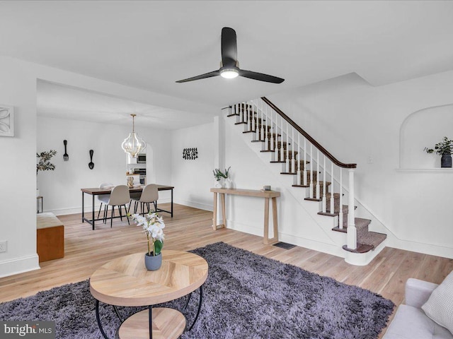 69 Mary Elmer Dr, Bridgeton, NJ 08302 - living area featuring stairway, wood finished floors, and ceiling fan