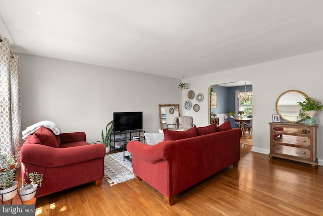 1906 Glen Keith Blvd, Towson, MD 21286 - living room featuring arched walkways and wood finished floors