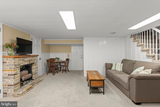 1906 Glen Keith Blvd, Towson, MD 21286 - carpeted living room with a decorative wall, stairway, and a fireplace