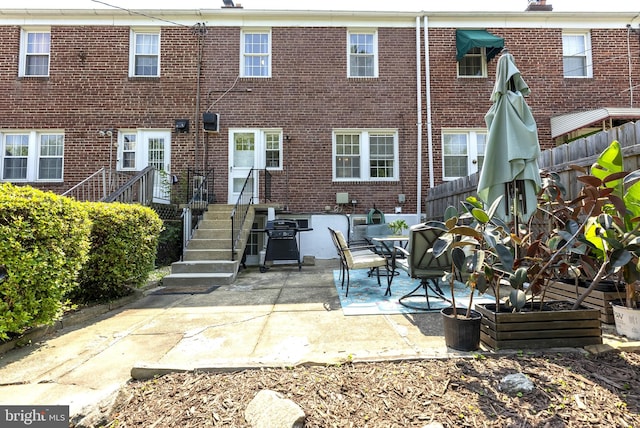 1906 Glen Keith Blvd, Towson, MD 21286 - back of house featuring brick siding and a patio area