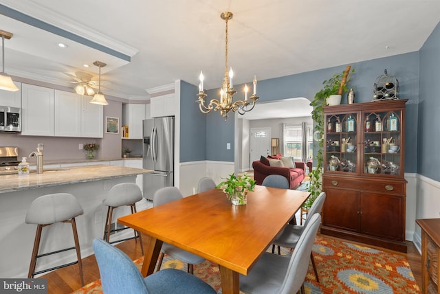1906 Glen Keith Blvd, Towson, MD 21286 - dining room featuring wood finished floors, wainscoting, and a chandelier