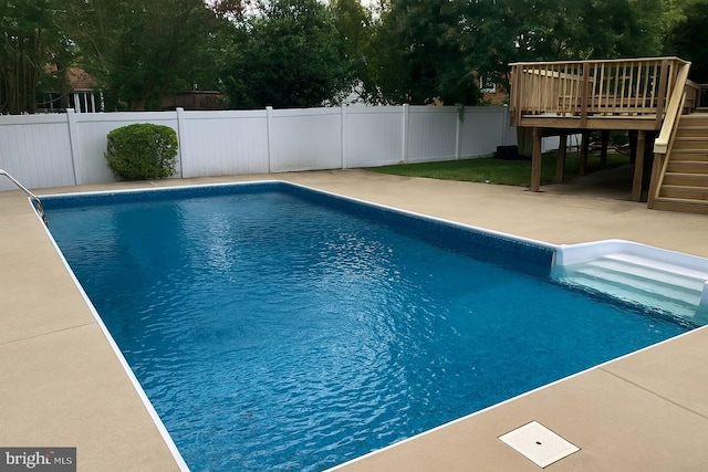 1121 Collingwood Rd, Alexandria, VA 22308 - view of swimming pool with stairway, a fenced backyard, a patio area, and a wooden deck