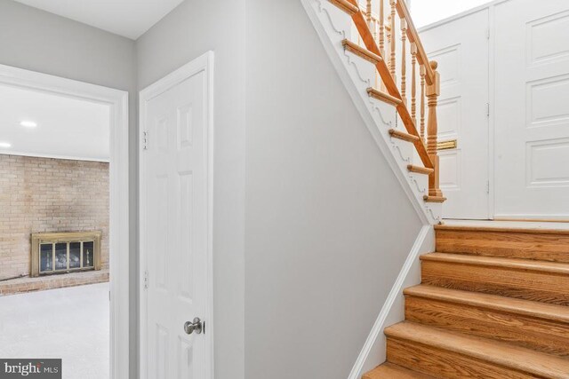 1121 Collingwood Rd, Alexandria, VA 22308 - stairs with a brick fireplace