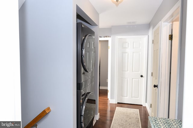 744 Caley Rd, King Of Prussia, PA 19406 - laundry room featuring stacked washer / drying machine and dark wood finished floors