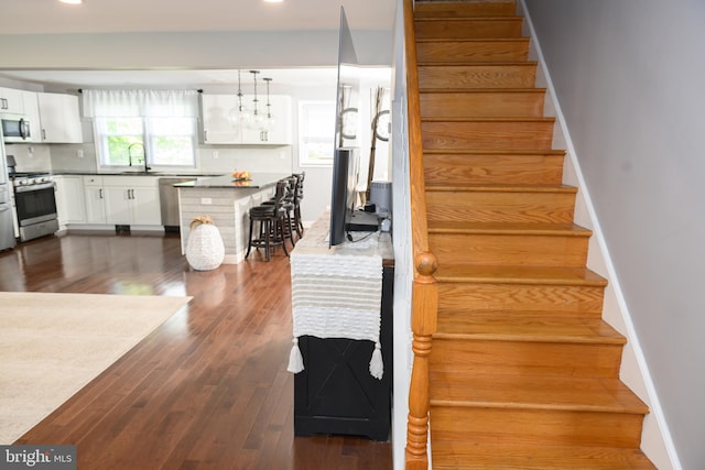 744 Caley Rd, King Of Prussia, PA 19406 - staircase with wood finished floors and recessed lighting