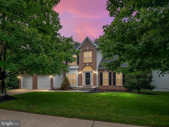 848 Sunny Chapel Rd, Odenton, MD 21113 - view of front facade with brick siding, driveway, a yard, and a garage