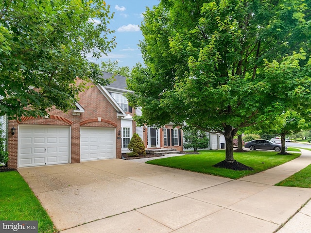 848 Sunny Chapel Rd, Odenton, MD 21113 - view of front of house featuring brick siding, driveway, a front yard, and a garage