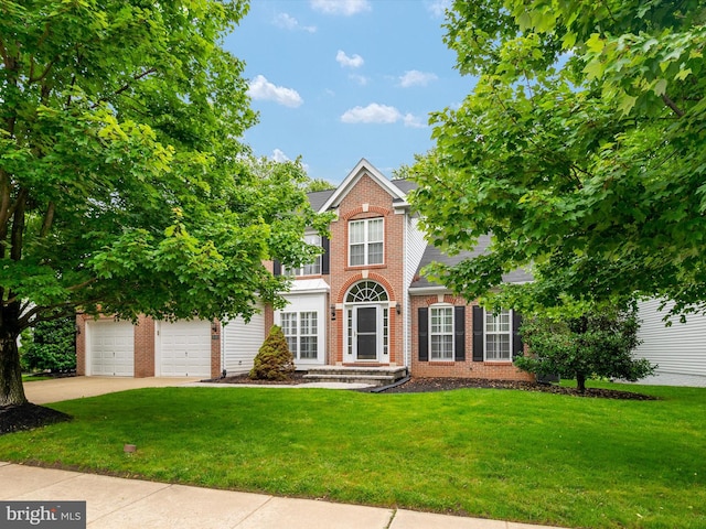 848 Sunny Chapel Rd, Odenton, MD 21113 - view of front facade with brick siding, a front lawn, driveway, and a garage