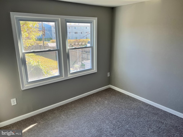 2011 Larkhall, Baltimore, MD 21222 - spare room featuring dark carpet and baseboards