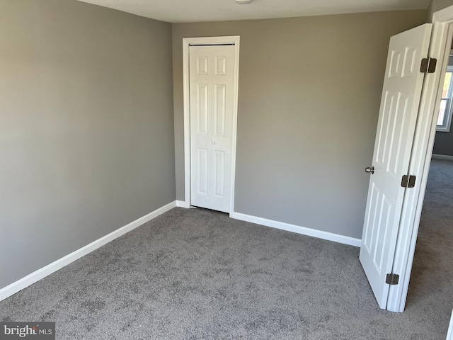 2011 Larkhall, Baltimore, MD 21222 - unfurnished bedroom with dark carpet and baseboards