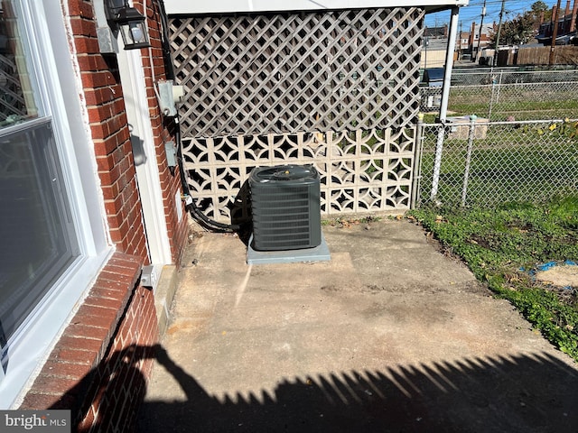 2011 Larkhall, Baltimore, MD 21222 - exterior view of a cooling unit and brick siding