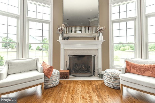 405 Hoffman Rd, Harleysville, PA 19438 - living room with a fireplace with raised hearth, healthy amount of natural light, and wood finished floors