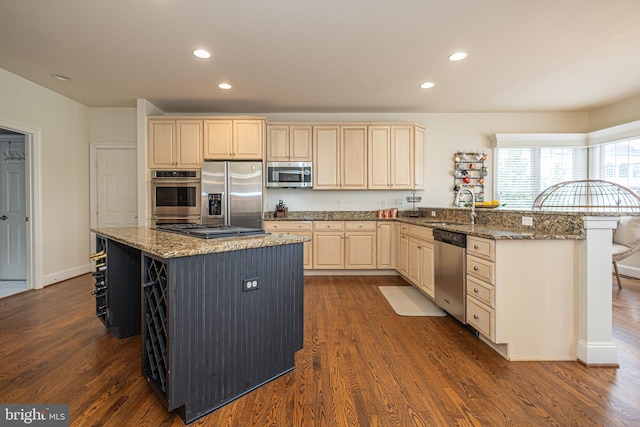 405 Hoffman Rd, Harleysville, PA 19438 - kitchen with appliances with stainless steel finishes, a breakfast bar area, dark wood finished floors, recessed lighting, and a peninsula