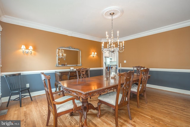 405 Hoffman Rd, Harleysville, PA 19438 - dining space with ornamental molding, wood finished floors, and a chandelier