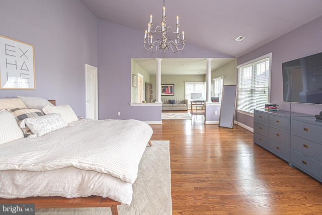 405 Hoffman Rd, Harleysville, PA 19438 - bedroom with ornate columns, lofted ceiling, wood finished floors, and a chandelier