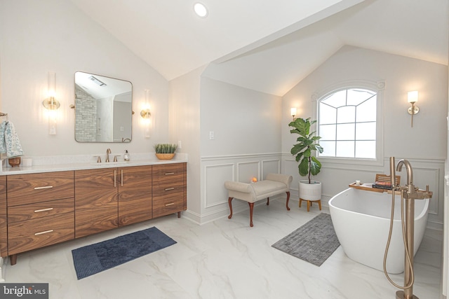 405 Hoffman Rd, Harleysville, PA 19438 - full bathroom with vaulted ceiling, marble finish flooring, a decorative wall, vanity, and a wainscoted wall