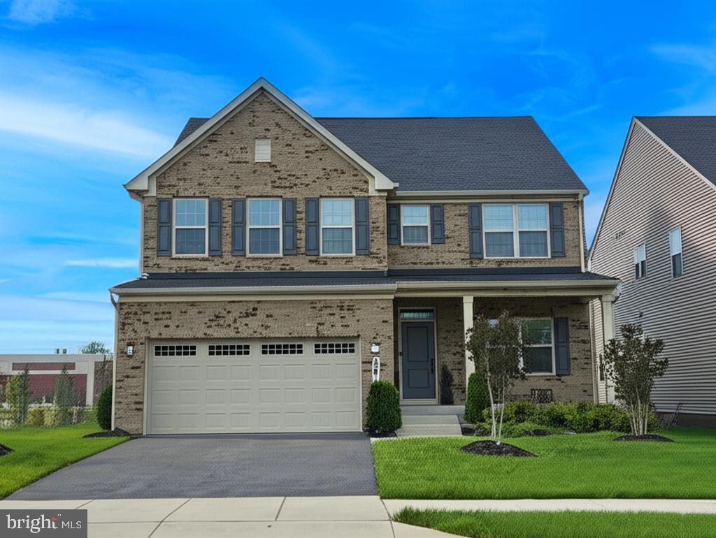 14709 Ring House Rd, Brandywine, MD 20613 - view of front of property featuring brick siding, driveway, a garage, and a front lawn