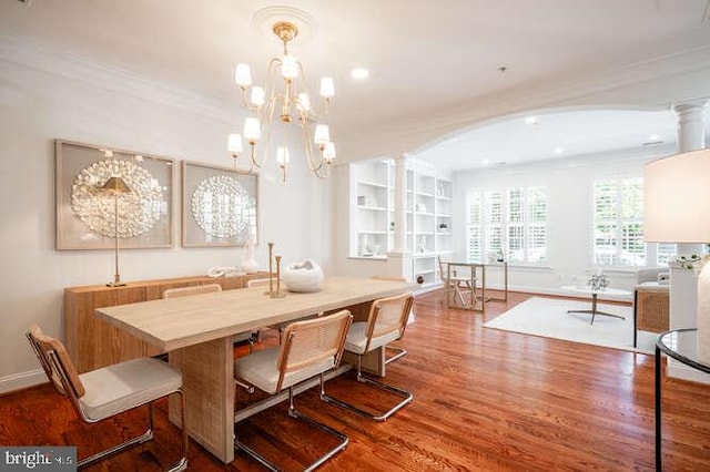 409 S Henry St, Alexandria, VA 22314 - dining room featuring wood finished floors, crown molding, a chandelier, arched walkways, and recessed lighting