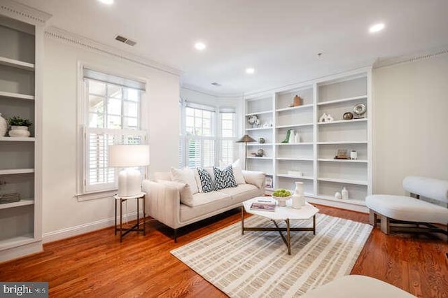409 S Henry St, Alexandria, VA 22314 - living area with ornamental molding, wood finished floors, recessed lighting, and built in shelves