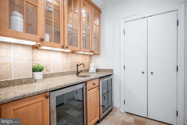 409 S Henry St, Alexandria, VA 22314 - kitchen featuring beverage cooler, crown molding, tasteful backsplash, glass insert cabinets, and light stone counters