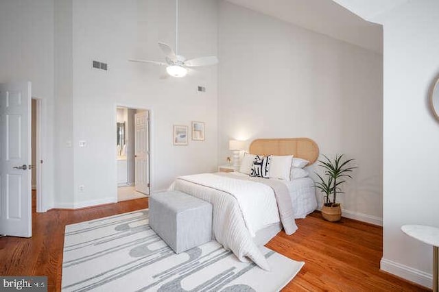 409 S Henry St, Alexandria, VA 22314 - bedroom featuring a high ceiling, wood finished floors, and a ceiling fan