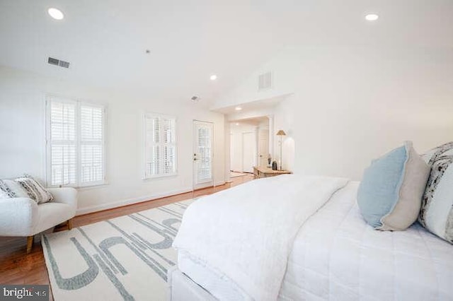409 S Henry St, Alexandria, VA 22314 - bedroom featuring recessed lighting, vaulted ceiling, and wood finished floors