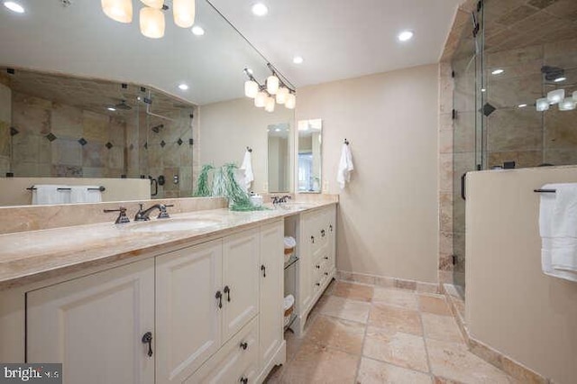 409 S Henry St, Alexandria, VA 22314 - full bathroom with double vanity, a shower stall, and recessed lighting
