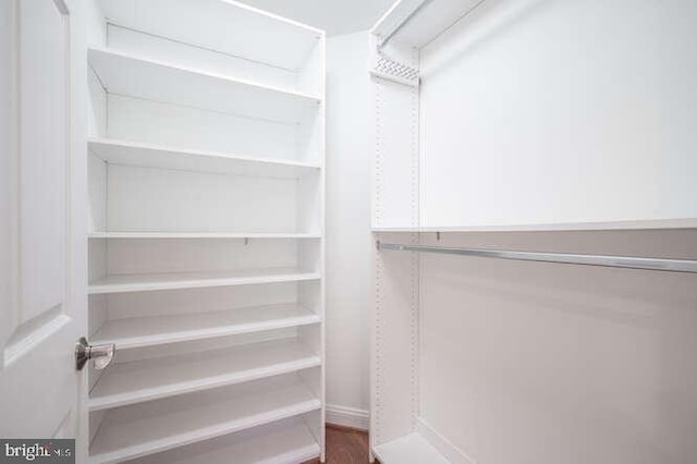 409 S Henry St, Alexandria, VA 22314 - walk in closet with wood finished floors