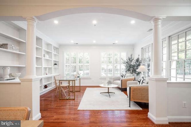 409 S Henry St, Alexandria, VA 22314 - living room with decorative columns, healthy amount of natural light, crown molding, and recessed lighting