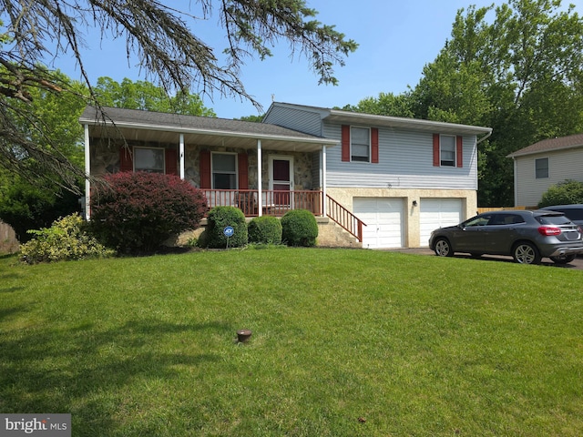 100 Constitution Ave, Reading, PA 19606 - tri-level home with a porch, a garage, a front yard, and driveway