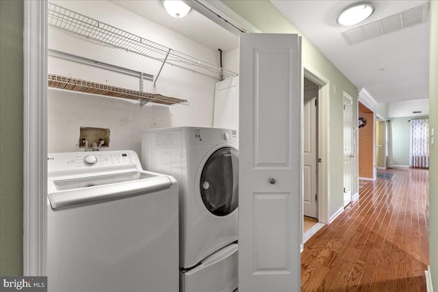 326 Brickhouse Rd, Princeton, NJ 08540 - laundry room featuring washing machine and dryer and wood finished floors