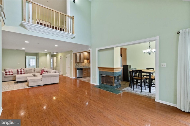 326 Brickhouse Rd, Princeton, NJ 08540 - living area with a high ceiling, wood finished floors, and a chandelier