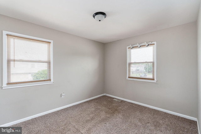 2801 Banks Ct, Dumfries, VA 22026 - empty room featuring healthy amount of natural light and carpet flooring