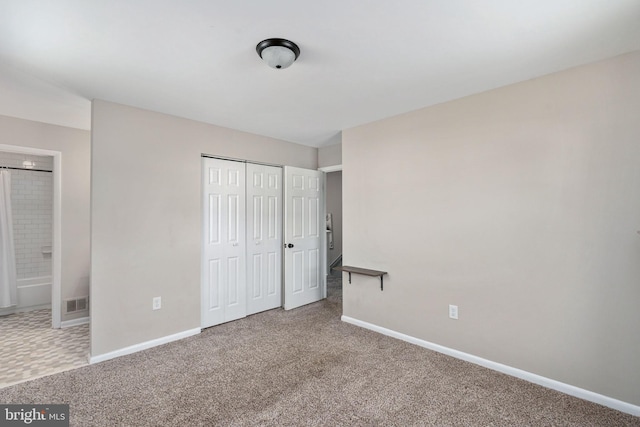 2801 Banks Ct, Dumfries, VA 22026 - unfurnished bedroom featuring carpet floors, a closet, and ensuite bathroom