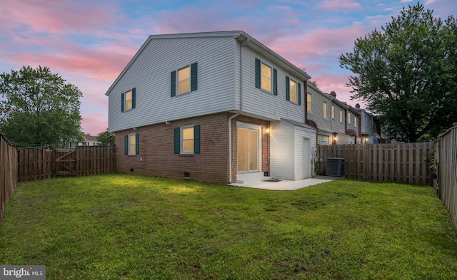 2801 Banks Ct, Dumfries, VA 22026 - rear view of house with crawl space, brick siding, a fenced backyard, entry steps, and a patio