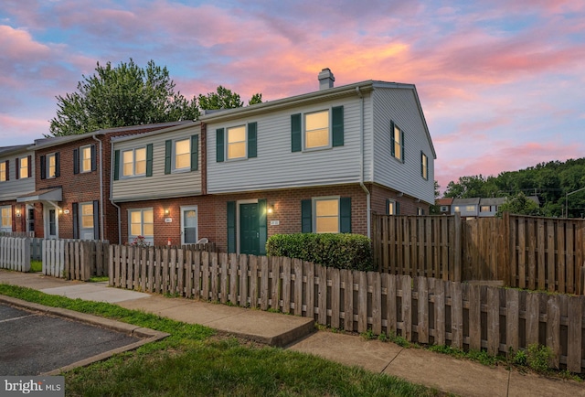 2801 Banks Ct, Dumfries, VA 22026 - townhome / multi-family property with a chimney and brick siding