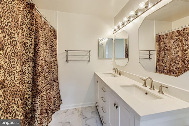 4174 La Mauricie Loop, Dumfries, VA 22025 - bathroom with double vanity and marble finish flooring