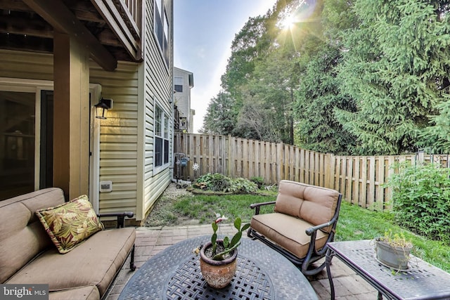 4174 La Mauricie Loop, Dumfries, VA 22025 - fenced backyard featuring an outdoor hangout area and a patio area