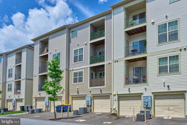 9423 Geaton Park Pl, Lanham, MD 20706 - view of apartment building / complex featuring a garage and driveway