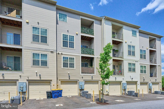 9423 Geaton Park Pl, Lanham, MD 20706 - view of apartment building / complex with driveway and a garage