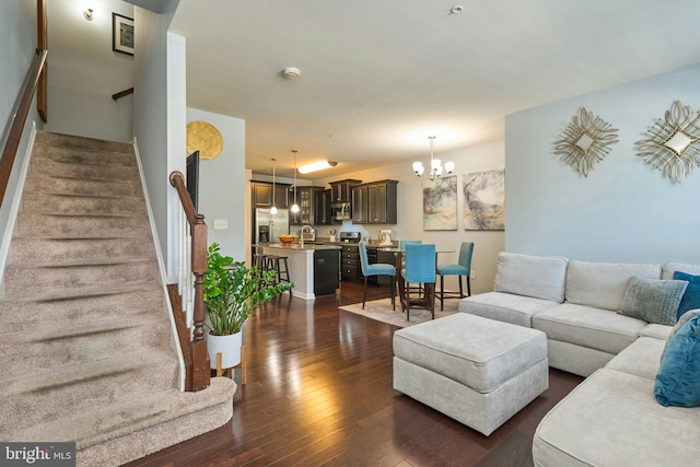9423 Geaton Park Pl, Lanham, MD 20706 - living room with a chandelier, stairs, and dark wood-type flooring